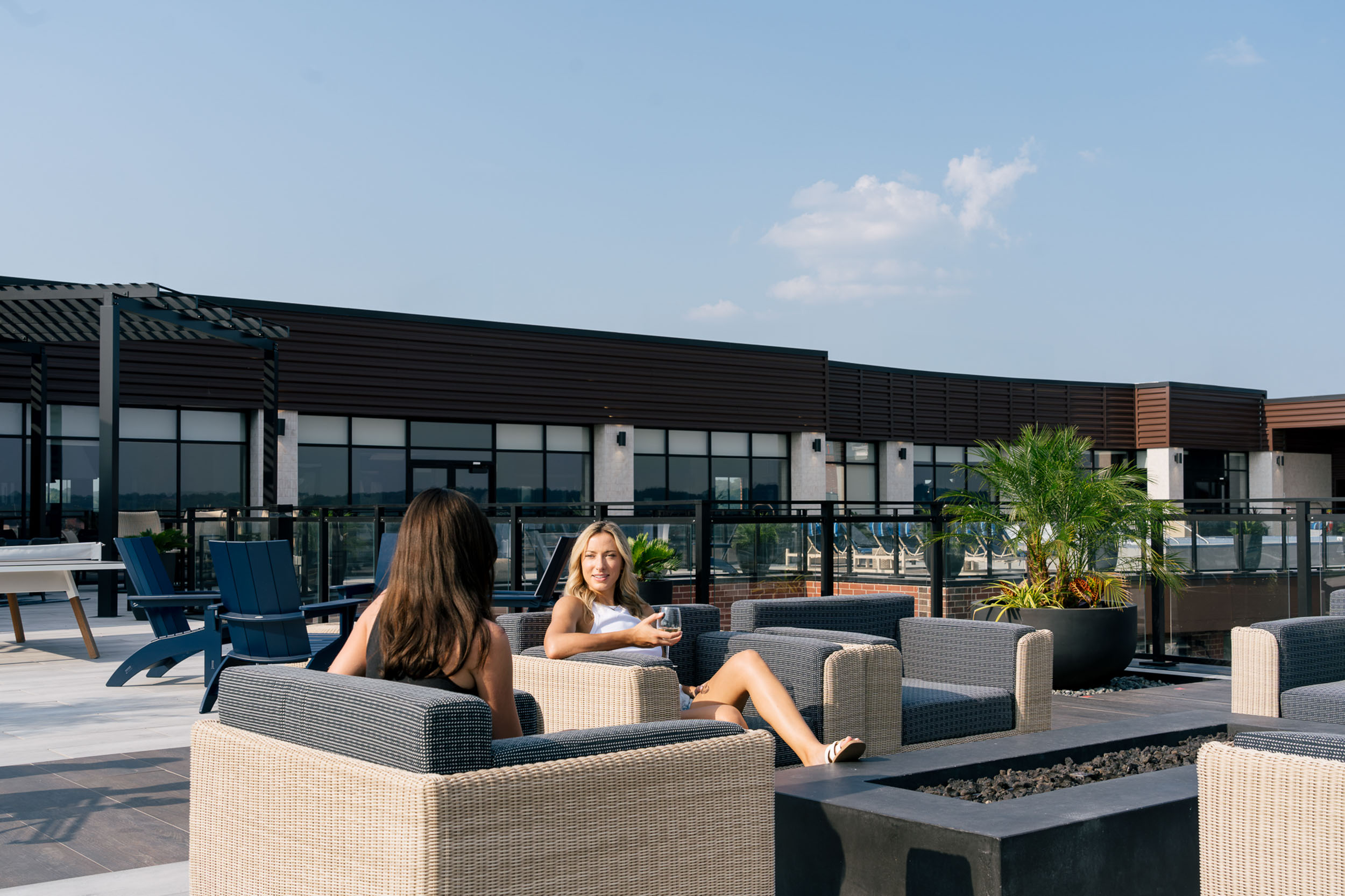 two people at the fire pit at the oxbow rentals north kansas city